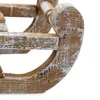 A close-up shot of a wooden sled decoration with a distressed white finish. Voir les images du produit