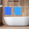 A bathroom scene with a bathtub and a clothesline with two blue towels hanging on it. Náhľad obrázku produktu