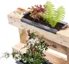 Close-up view of planters attached to a wooden pallet, with plants growing in them. Náhľad obrázku produktu