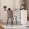 A modern home office setup with a white L-shaped desk, a beige chair, and decorative elements. Náhľad obrázku produktu
