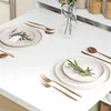 A clean and minimalist dining table setting with place settings. Náhľad obrázku produktu