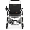 A front view of a black and silver electric wheelchair. Náhľad obrázku produktu