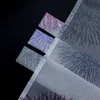 Several pieces of fabric with a firework pattern are arranged diagonally on a black background. Produktbild-Vorschau