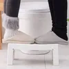 Two people are standing on a white stool in front of a toilet. Anteprima dell’immagine prodotto