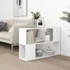 A white bookshelf with books and decorative items in a living room setting next to a sofa. Náhled obrázku produktu