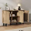 A wooden sideboard with its doors open, displaying shelves and items inside, set against a textured wall. Anteprima dell’immagine prodotto
