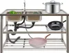 A stainless steel double sink with a faucet and various kitchenware items placed on and under it. Náhled obrázku produktu