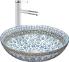 A white faucet is positioned behind a decorative basin. Podgląd zdjęcia produktu