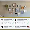 A wall decorated with various picture frames and decorative items, with text overlays describing product features. Náhľad obrázku produktu