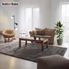 A living room scene with a sofa, coffee table, rug, and chair. Voir les images du produit