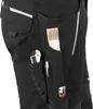 Close-up of the side pocket of black work pants, showing tools and reflective elements. Produktbild-Vorschau