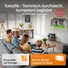A family is watching TV in a modern living room. The TV is mounted on the wall with a bracket. Voir les images du produit