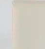 A close-up view of the corner of an ivory-colored upholstered chair. Voir les images du produit