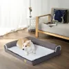 A dog is resting on a dog bed in a living room setting. Náhľad obrázku produktu