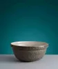 A grey ceramic bowl with a raised pattern of leaves and a fox, set against a teal background. Podgląd zdjęcia produktu
