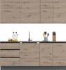 A modern kitchen counter with cabinets, a sink, and various kitchen utensils and bottles. Náhled obrázku produktu