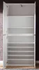 An open white wardrobe with multiple shelves, set against a textured wall. Produktbild-Vorschau