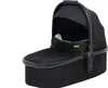 A black baby bassinet for a stroller, shown from a slightly elevated side angle against a white background. Produktbild-Vorschau