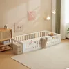 A child's bed with safety rails in a room. Anteprima dell’immagine prodotto