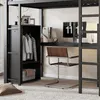A loft bed with a built-in desk and wardrobe, set up in a bedroom. Anteprima dell’immagine prodotto