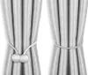 Two sets of curtains are shown, each held back by a magnetic tie-back. Náhľad obrázku produktu