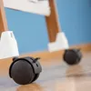 A close-up view of the wheels of a laundry rack. Náhled obrázku produktu