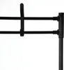 A close-up view of a black shoe rack with two horizontal bars and a clip-like attachment. Produktbild-Vorschau