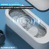 Close-up of an ultrasonic cleaner with water and items being cleaned, with text overlays. Produktbild-Vorschau