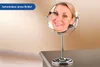 A woman applies mascara to her eye in a mirror, with text overlay. Produktbild-Vorschau