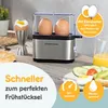 A close-up shot of a GOURMETMAXX egg cooker on a kitchen counter, with two eggs inside and one boiled egg in an egg cup. Produktbild-Vorschau