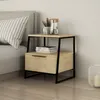 A modern nightstand next to a bed in a bedroom setting. Produktbild-Vorschau