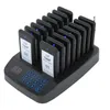 A black charging base with 16 wireless pagers, each with a white label displaying 'Welcome' and a number. Voir les images du produit
