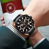 A person wearing a watch and holding a wine bottle. Produktbild-Vorschau