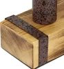 A close-up view of a wooden base with a decorative metal band and a speckled cylindrical object, likely part of a lamp. Produktbild-Vorschau