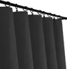A close-up view of several black curtains hanging from a black curtain rod. Produktbild-Vorschau