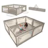 A baby playing in a playpen with toys, and a folded playpen with a carrying bag. Produktbild-Vorschau