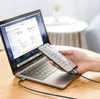 A hand holds a smartphone connected to a laptop via a USB-C cable. Produktbild-Vorschau