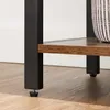Close-up of the metal legs and wooden shelf of a furniture item, possibly a bookshelf. Produktbild-Vorschau