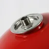 Close-up view of a red object with a metallic fitting. Produktbild-Vorschau