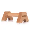 A pair of wooden push-up bars with the brand logo on one of the supports, isolated on a white background. Podgląd zdjęcia produktu