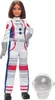 A Barbie astronaut doll standing next to her helmet. Produktbild-Vorschau