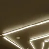 Several linear LED light fixtures are mounted on a dark ceiling. Produktbild-Vorschau