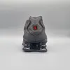 The back view of a Nike Shox TL sneaker against a plain gray background. Produktbild-Vorschau