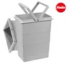 A gray Hailo trash can insert with two handles and an attached compartment. Voir les images du produit