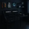 A dark, modern gaming room setup with a corner desk, multiple monitors, a gaming chair, and decorative posters on the wall. Produktbild-Vorschau