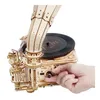 A hand is shown adjusting a knob on a wooden model of a gramophone. Náhľad obrázku produktu
