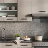 A modern kitchen scene with cabinets, a sink, and a stovetop. Anteprima dell’immagine prodotto