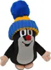 A plush toy mole wearing a blue and yellow knitted hat with a pom-pom. Produktbild-Vorschau