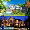 A split image showing a house during the day with a solar panel and a house at night decorated with LED string lights. Náhľad obrázku produktu