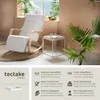 A modern living room scene featuring a rocking chair and a side table. Produktbild-Vorschau